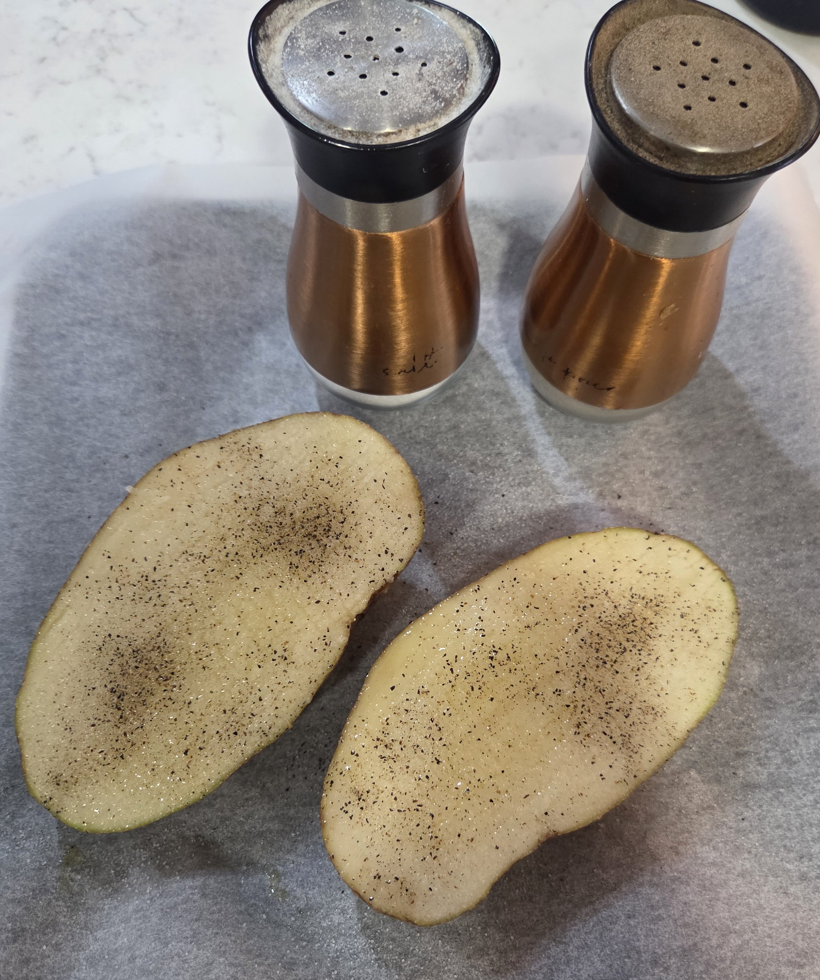 Potato halves seasoned with salt and pepper