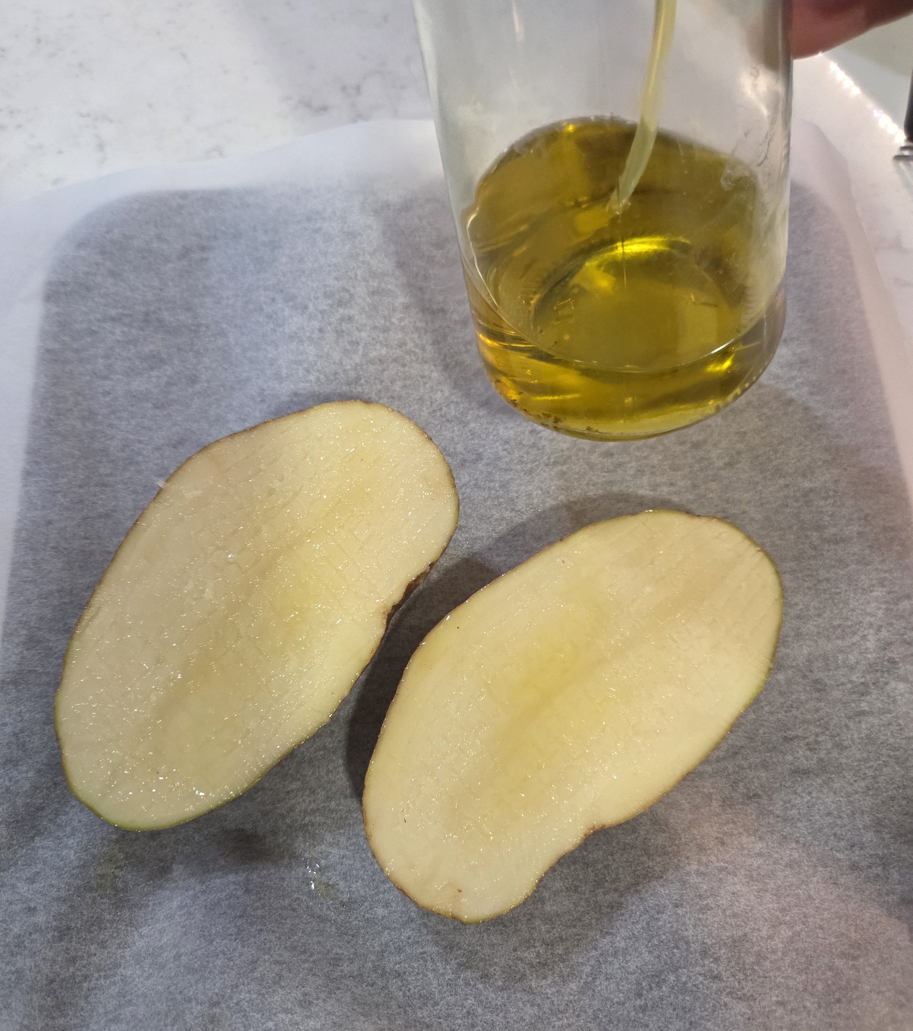 Russet potato halves with EVOO spray